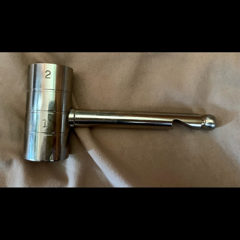 Raise The Bar 2oz measuring cup with bottle opener